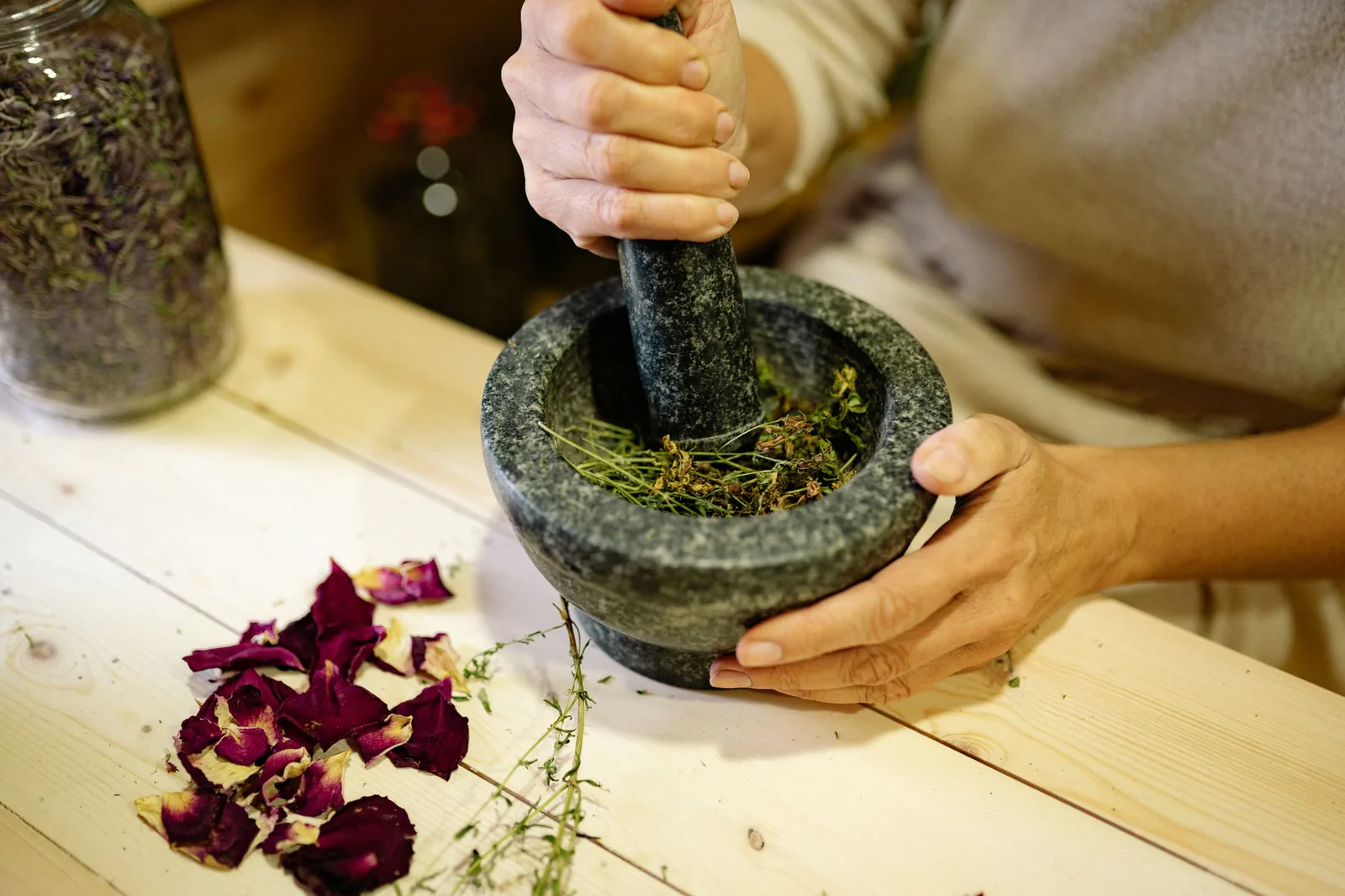 Grinding botanical ingredients in a mortar and pestle