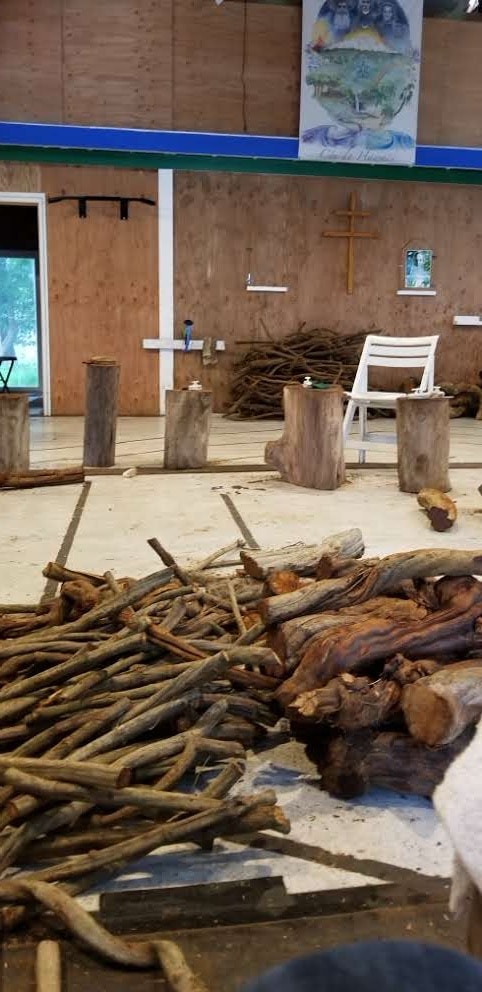 Rustic church interior with wooden logs and natural light