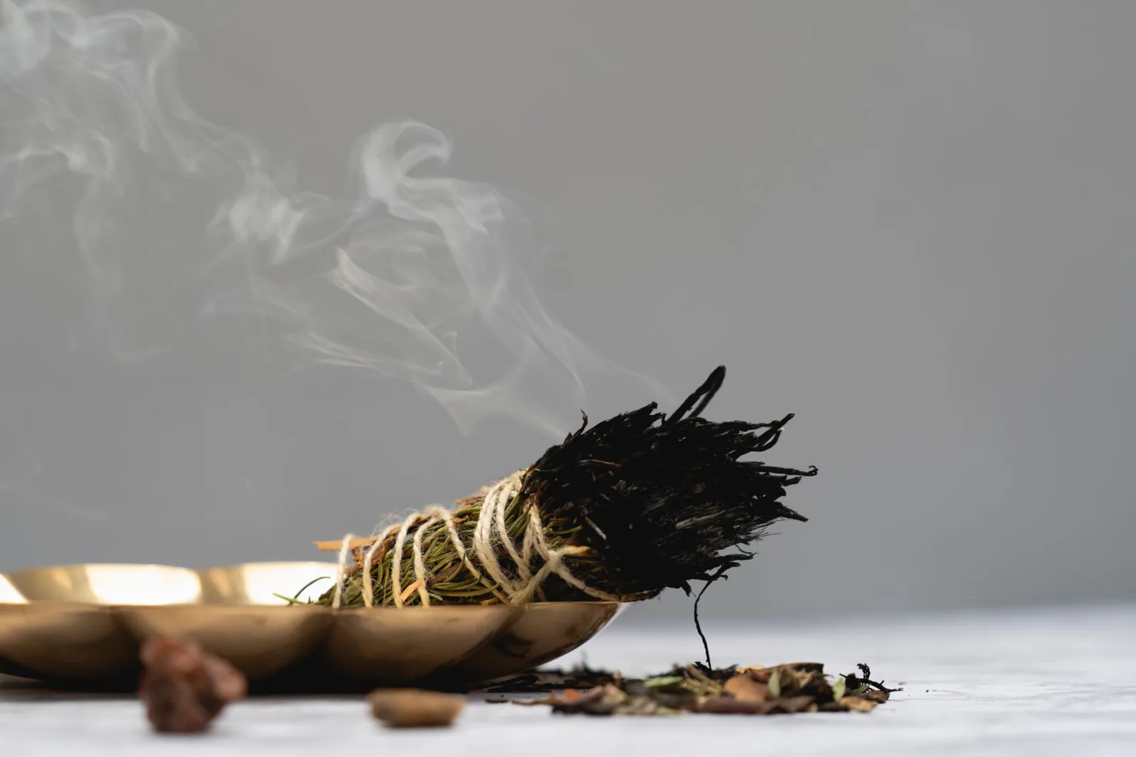 Sage smudge burning in a calm ritual setting